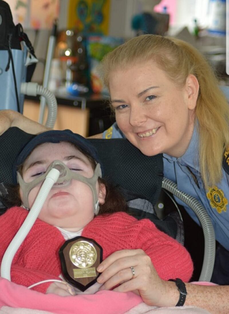 Sgt Emer Lamon with a little blue hero Daisy.