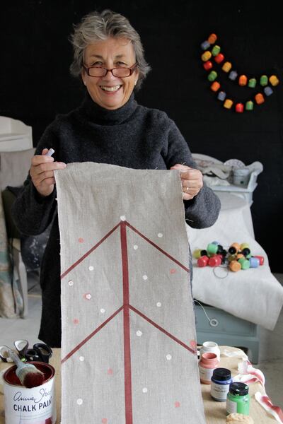 Annie Sloan and her potato printed table runner made using Chalk Paint