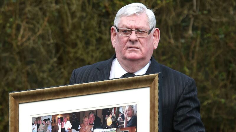 Albert O’Connor carries a montage of photograps of his late brother Christy O’Connor Jnr, into the Church of Saint John the Apostle, Knocknacarra, Galway. Photograph: Joe O’Shaughnessy.