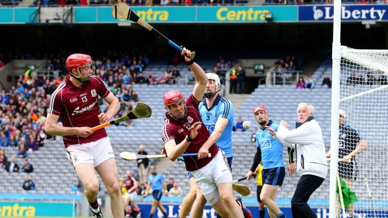 Dublin’s Peter Kelly and Jonathan Glynn of Galway battle for possession during the Leinster SHC quarter-final at Croke Park. Photo: Cathal Noonan/Inpho