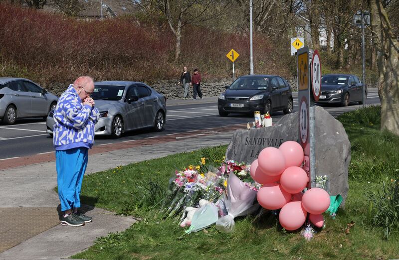 Many people laid flowers and said prayers at the site where the girl was struck. Photograph: Joe O'Shaughnessy