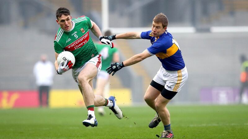 Mayo’s Patrick Durcan and Brian Fox of Tipperary in the  All-Ireland SFC semi-final at Croke Park on December 6th. Photograph: Ryan Byrne/Inpho