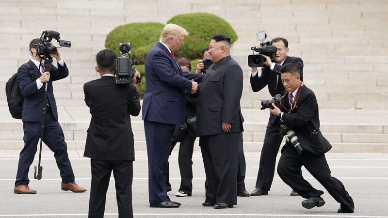 US president Donald Trump meets North Korean leader Kim Jong-un. Photograph: Kevin Lamarque/Reuters