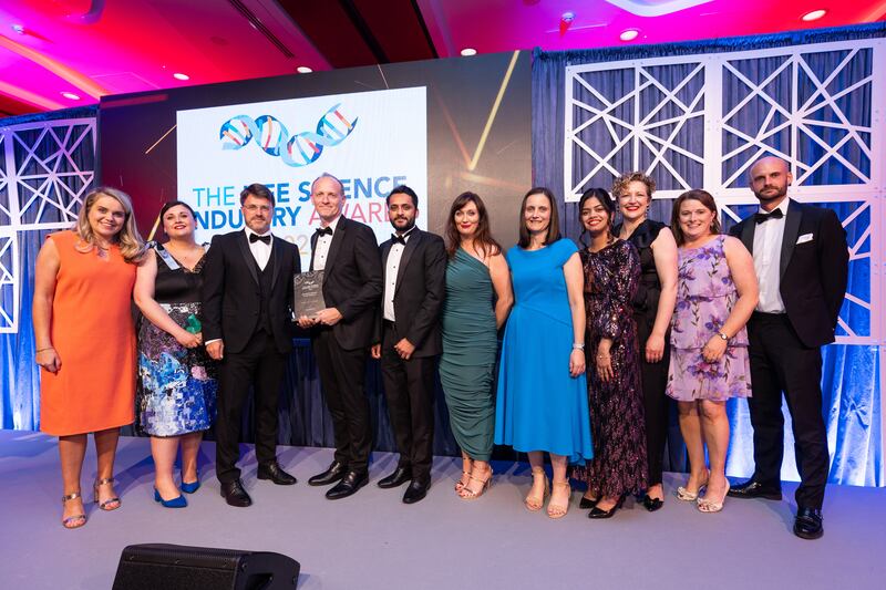 Roy Fahy, operations director at Unispace Life Sciences, presents the overall excellence in life sciences award to Janssen Sciences Ireland team
