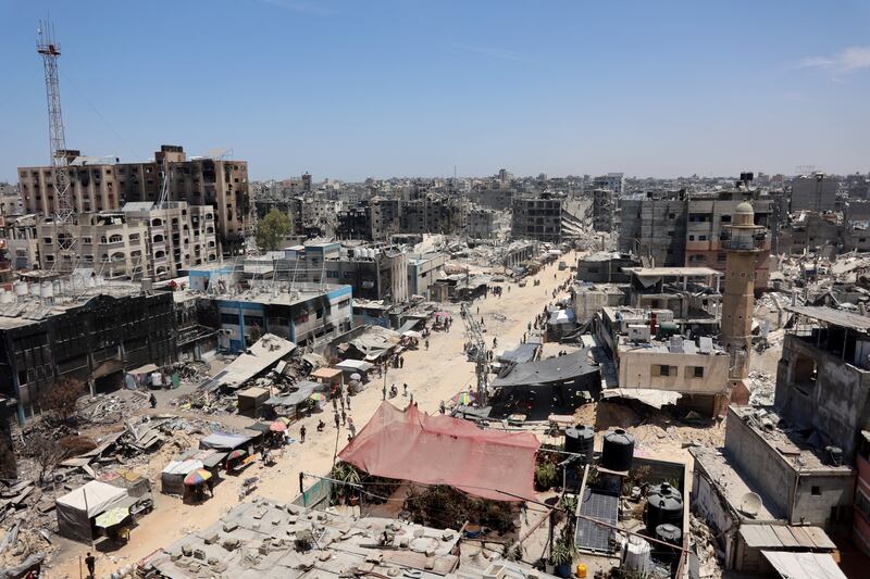 Food and good stalls are set up by vendors outside the burnt-out ruins of a UN agency in the Jabalia refugee camp, Gaza, on June 7th, amid the ongoing conflict between Israel and the Palestinian Hamas militant group. Photograph: Omar al-Qattaa/AFP/Getty