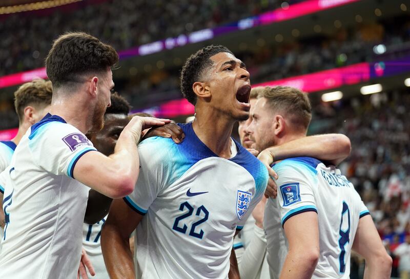 Jude Bellingham celebrates the opening goal scored by Jordan Henderson against Senegal in the World Cup last-16 tie.