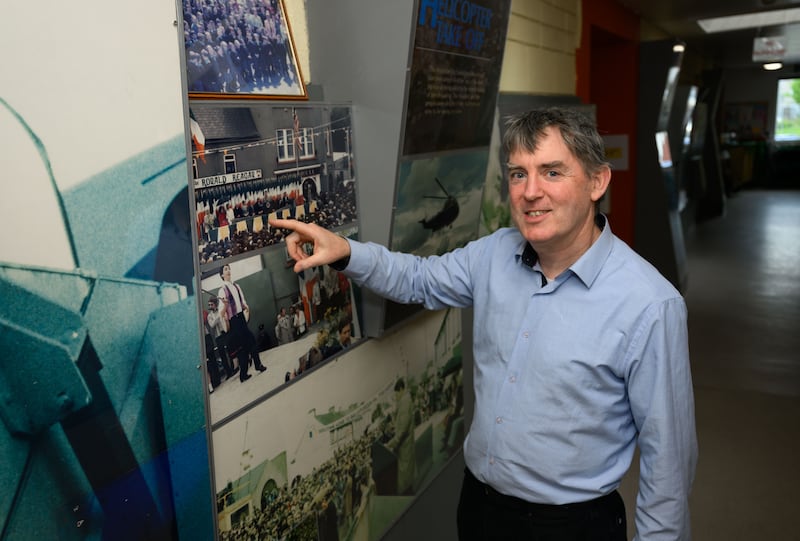 Michael Geary of Ballyporeen Community Council alongside the President Ronald Reagan exhibition in Scoil Teampall Toinne, Ballyporeen. Photograph: Diarmuid Greene