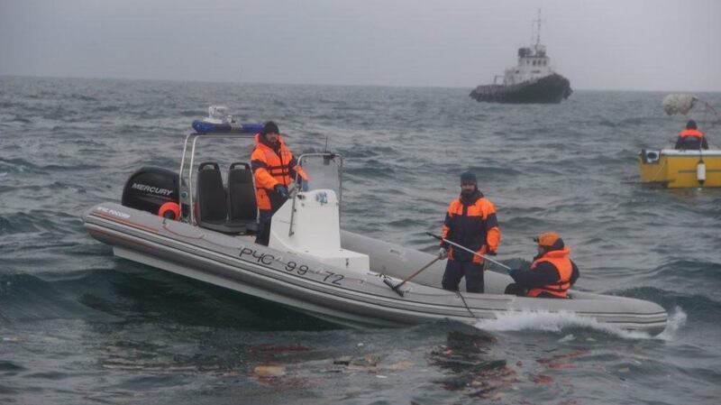 Rescue boats searching in Black Sea near coastline of Sochi for wreckage of the Russian Tu-154 plane. Photograph: EPA
