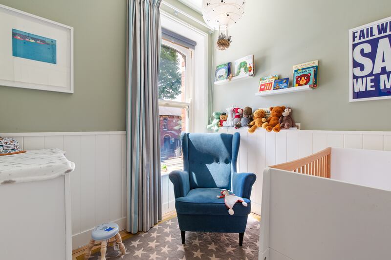 A single bedroom is on the first floor features wood panelling and has been presented as a lovely nursery. Photograph: Keith Owens
