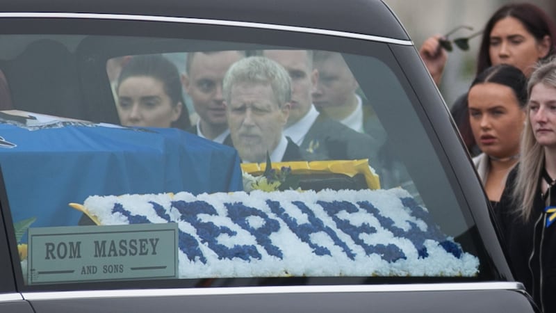 A floral tribute to Stephen Lynch at his funeral at St Aidan’s Church, Brookfield, Tallaght, Dublin. Photograph: Collins