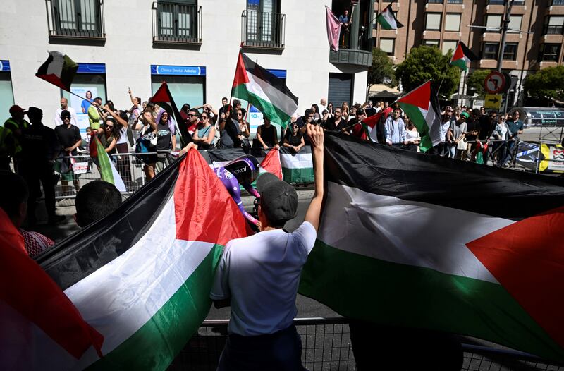 Pro-Palestinians protesters demonstrate as cyclists compete during the Vuelta a Espana. Photograph: Miguel Riopa/AFP via Getty Images        