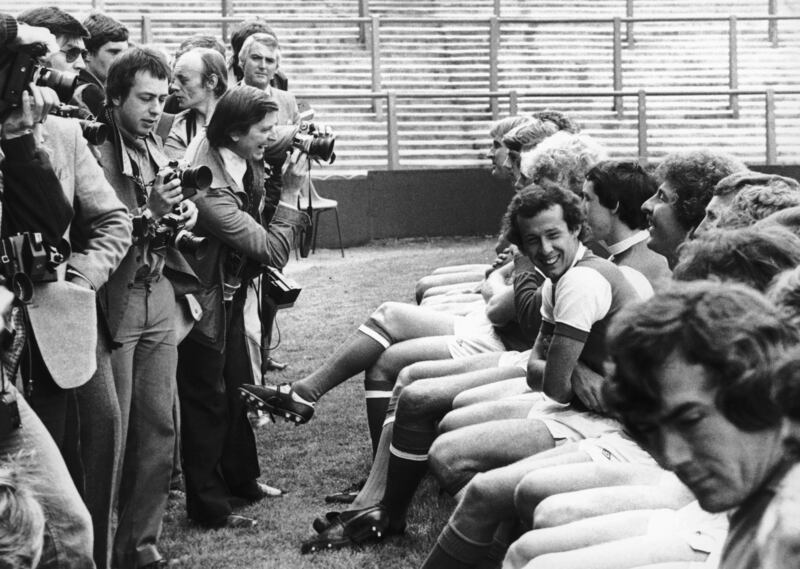 Liam Brady joking with his team-mate Alan Sutherland during an Arsenal photocall with the press at Highbury in 1980. Goalkeeper Pat Jennings is in the foreground. Photograph:  Mike Stephens/Central Press/Getty Images