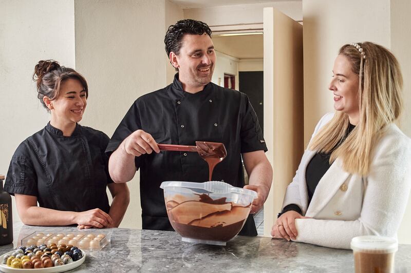 The chocolates feature a plethora of Irish flavours from whiskey from Dingle Distillery to Rogan’s smoked sugar from Westmeath. The couple are pictured in the café’s kitchen alongside AIB Dingle branch manager. Róisín Healy. Photograph: Bríd Ní Luasaigh