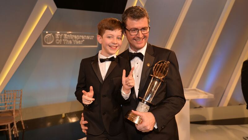 EY International Entrepreneur of the Year and overall winner of the Entrepreneur of the year award 2016, Brendan Mooney of Kainos with his son Odhran. Photograph: Alan Betson