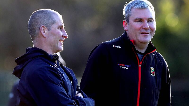 Stuart Lancaster  talks with  Mayo manager James Horan at a Leinster training session at UCD in December.Photograph: Ryan Byrne/Inpho