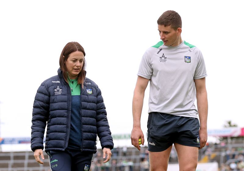 Caroline Currid with Gearóid Hegarty during her time working with Limerick's hurlers. Photograph: James Crombie/Inpho