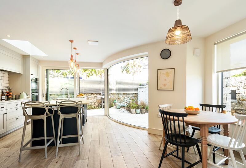 Curved glass in the kitchen area adds both interest and light