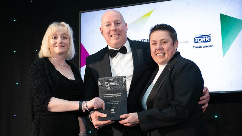 Les Sheridan, Managing Director, Mitie Facilities Management presents the Best People Development in Facilities Management award to Áine Fleming & Tara Hyland, Alexion Ireland.