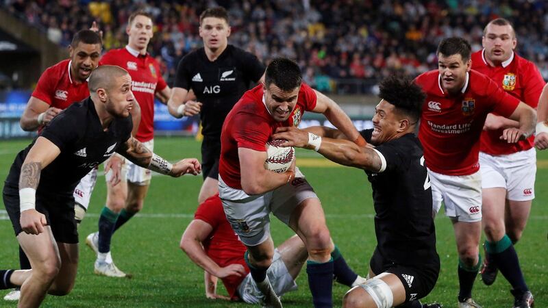 Conor Murray bursts over for his try. Photo: Anthony Phelps/Reuters