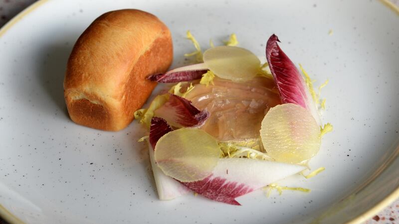 Foie gras, apple, bonito, bitter leaves and brioche.