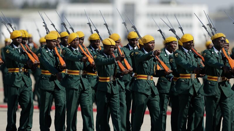A guard of honour march at the RG Mugabe Airport for the return of the remains  Robert Mugabe in Harare. Photograph: Themba Hadebe/AP Photo