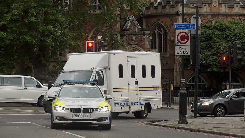 A convoy of police vehicles believed to be transporting Tommy Mair arrives at Westminster Magistrates Court in London on Saturday.  Mair (52) has been charged with the murder of Labour MP Jo Cox who was murdered in Birstall on Thursday. Photograph: Hannah McKay/EPA