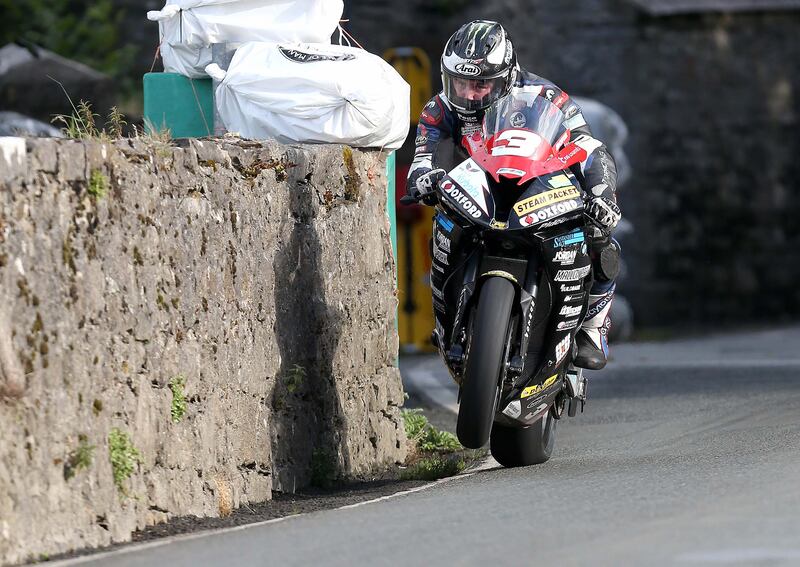 Michael Dunlop narrowly avoids the wall on his BMW during the 2016 Southern 100 races on the Isle of Man. Photograph: Stephen Davison
