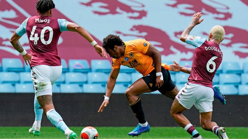 Douglas Luiz and Tyrone Mings try to tackle  Adama Traore during Aston Villa’s defeat to Wolves. Photograph: Tim Keeton/Getty/AFP