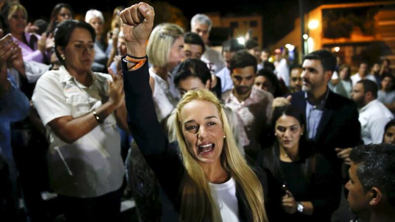 Lilian Tintori (C), wife of jailed opposition leader Leopoldo Lopez, shouts during a news conference in Caracas. Photograph: Carlos Garcia Rawlins/Reuters.