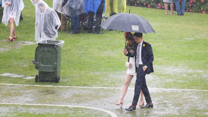 The rain hammers down after the first race, flooding parts of the course. Photo: Michael Dodge/Getty Images