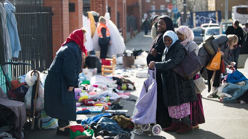 Teresa Carroll chats with  customers at her stall. Photograph: Tom Honan