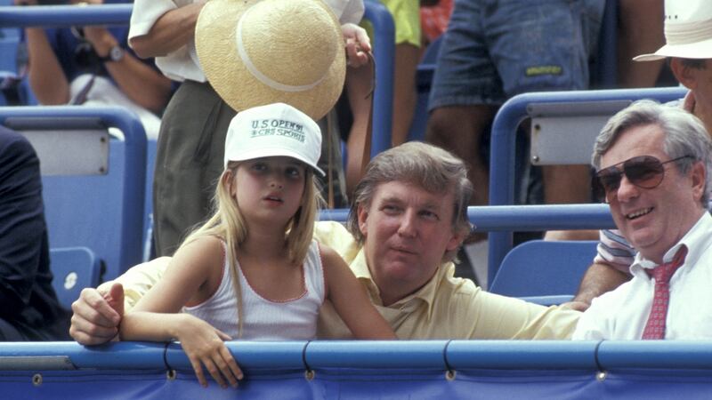 A young Ivanka with her father. Photograph: WireImage