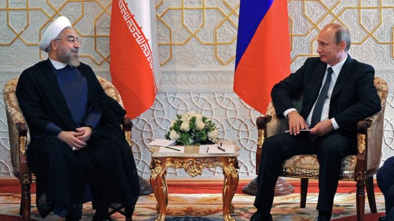 Iranian president Hassan Rouhani (L) and Russian president Vladimir Putin (R) sit for their meet in Dushanbe, Tajikistan, earlier this month. Mr Rouhani will meet David Cameron today in New York in what will be the first bilateral meetings between Britain and Iran since 1979. Photograph; Mikhail Klimentyev/RIA Novosti/EPA.