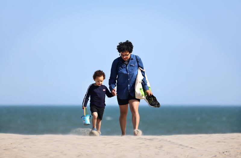 Shirlaine Corrigan from Donaghmede, with her son Fionn (4) on Dollymount Strand, Dublin on Tuesday. Photograph: Dara Mac Dónaill








