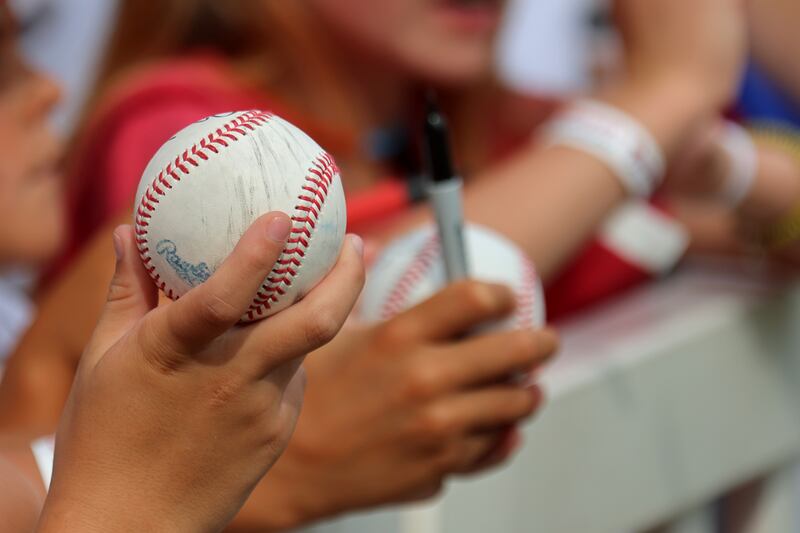 Young baseball fans attempt to get autographs before a game between New York Yankees and Atlanta Braves. Photograph: Jeff Robinson/Icon Sportswire via Getty Images