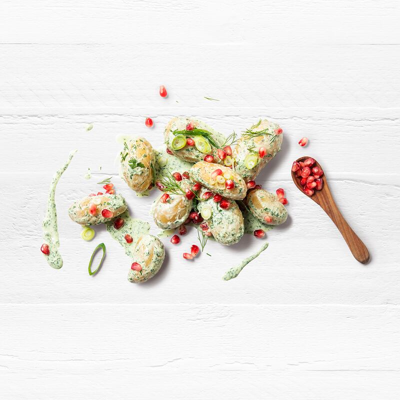 Herb and potato salad with Greek yoghurt and pomegranate