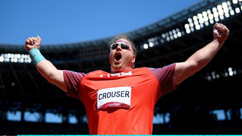 Ryan Crouser of the  United States celebrates after winning gold in the men’s shot put at the at the Olympic Stadium. Photograph: Matthias Hangst/Getty Images