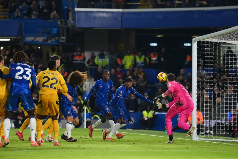 Noni Madueke of Chelsea scores his team's third goal past Jose Sa of Wolves. Photograph: Mike Hewitt/Getty