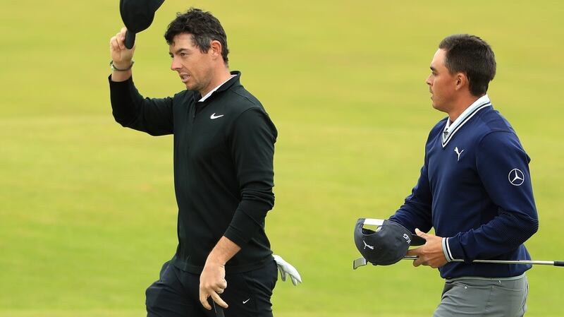Rory McIlroy acknowledges the crowd with Rickie Fowler during day one of the AAM Scottish Open. Photograph: Getty Images