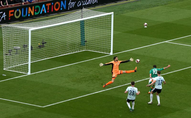 Troy Parrott heads past Craig Gordon to score the Republic of Ireland's second goal in the victory over Scotland at the Aviva Stadium. Photograph: Tom Maher/Inpho
