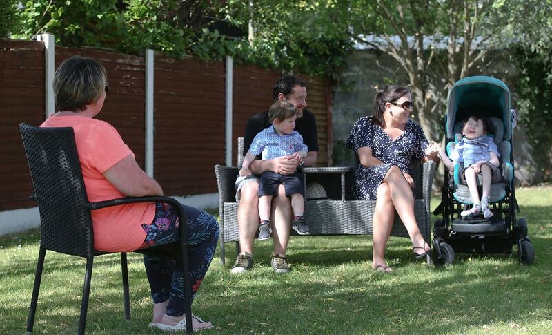 Denis and Maria O'Brien with their sons Ben and Harry as they get their first visit from their Jack & Jill nurse specialist Mary Joe Guilfoyle. Photograph: Laura Hutton