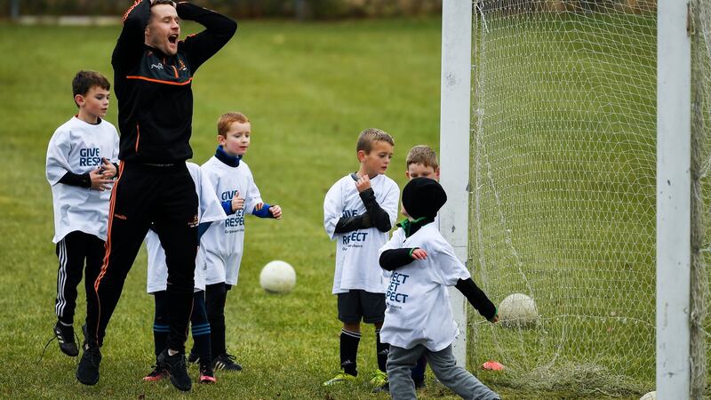 Andy Moran of Mayo  with members of the Philadelphia GAA Club during a coaching session as part of the PwC All Stars Football tour. Photograph: Ray McManus/Sportsfile