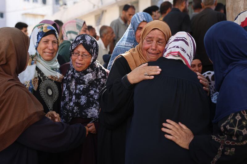 Women mourn at al-Shifa hospital, where the victims of an Israeli strike that hit the Mustafa Hafez school were taken. Photograph: Omar Al-Qattaa/Getty