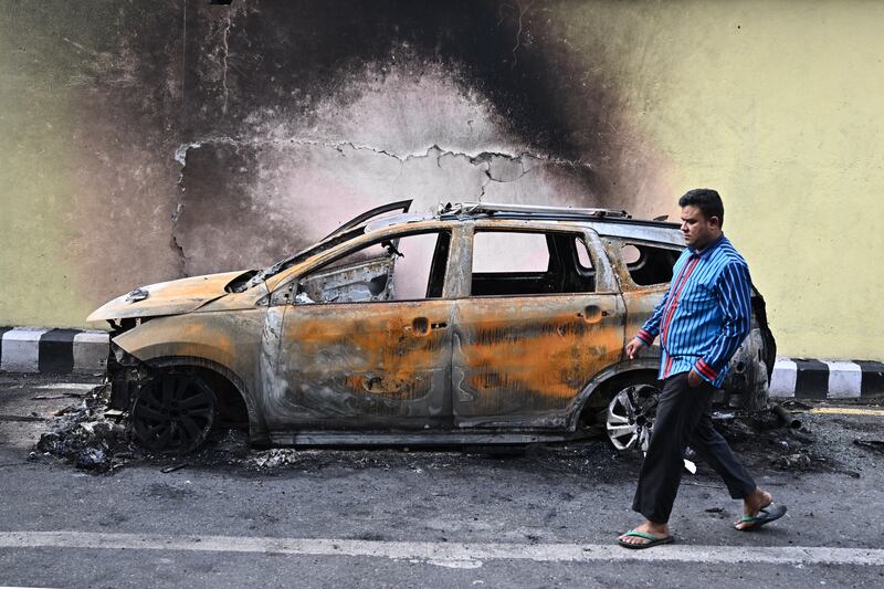 A man walks past a burnt car during a curfew imposed to restore law and order in Kathmandu last week. Photograph: Pedro Pardo/AFP via Getty Images       