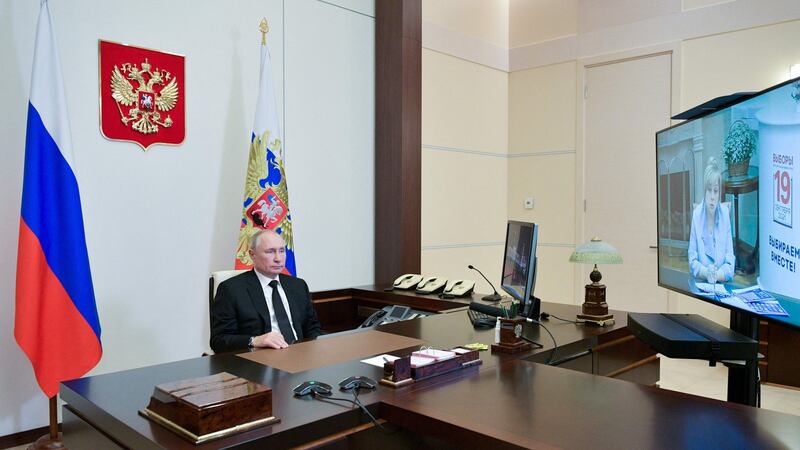 Vladimir Putin speaks with the chairwoman of Russia’s central election commission, Ella Pamfilova,  by video link on Monday. Photograph:  Alexei Druzhinin/Sputnik/AFP via Getty Images