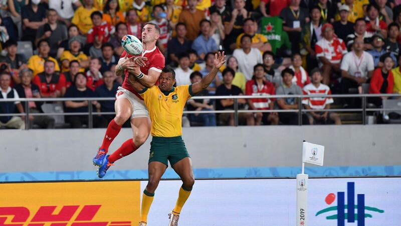 George North leaps to try and claim the ball ahead of Kurtley Beale during Wales’ win over Australia. Photograph: Toshifumi Kitamura/AFP/Getty