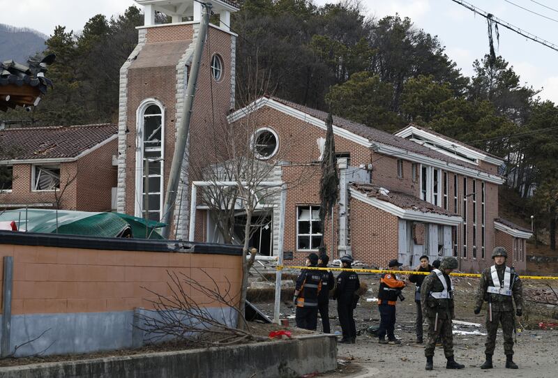 Soldiers and rescue services personnel outside a church in a village, the site of an accidental fighter jet bombing, in Pocheon, South Korea. Photograph: Jeon Heon-Kyun/EPA