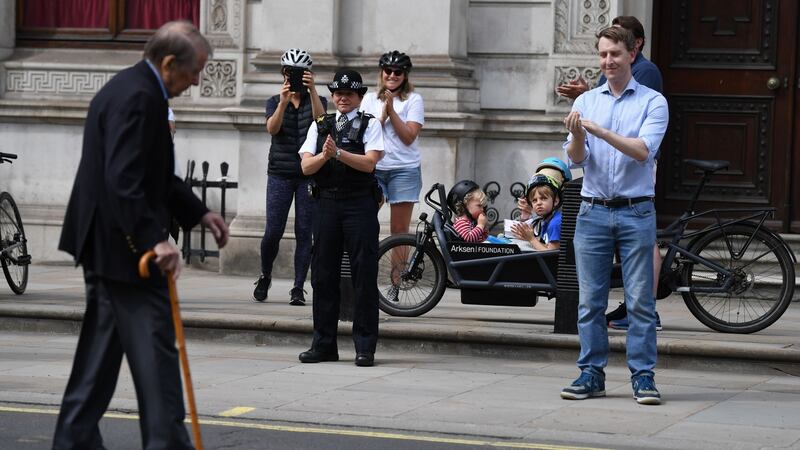 Veteran Lou Myers, 93 is applauded at the Cenotaph in London after taking part in a two-minute silence to mark the 75th anniversary of VE Day. Photograph: Daniel Leal-Olivas/AFP via Getty Images