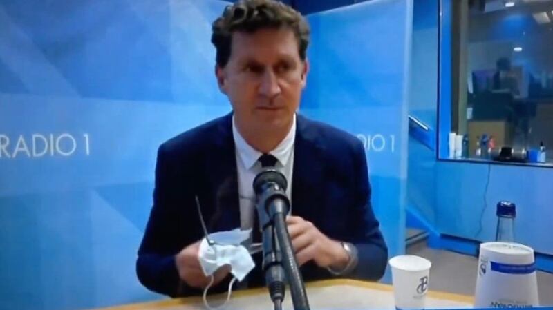 Eamon Ryan cleans his glasses with his facemask on RTÉ Radio 1’s Claire Byrne show