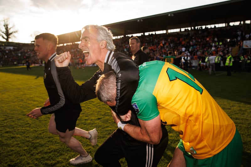 Donegal manager Jim McGuinness celebrates with Michael Murphy after the final whistle. Photograph: Ben Brady/Inpho